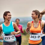 happy-athletic-women-talking-while-running-a-marat-2024-12-13-19-14-20-LRPRJ53.jpg