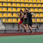 multiethnic-athlete-group-run-on-running-track-out-2025-02-16-22-36-30-PQPUCFV.jpg